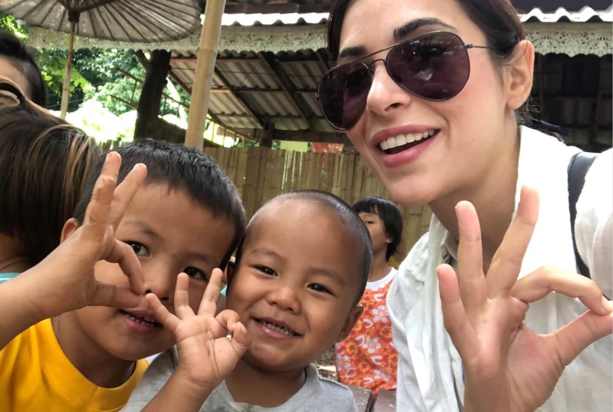 Selfie of one of our representatives with two Thai kids.