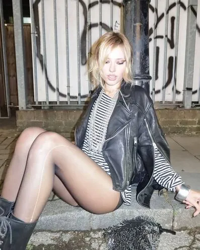 Woman sitting leather jacket