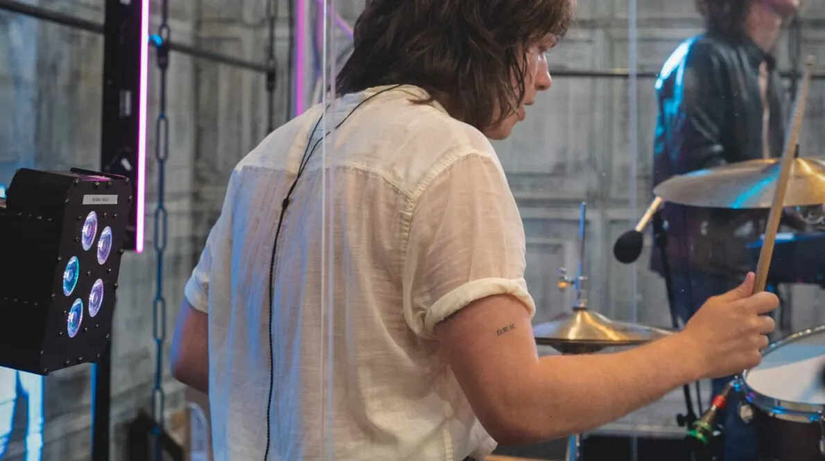 The Sukis band member playing the drums