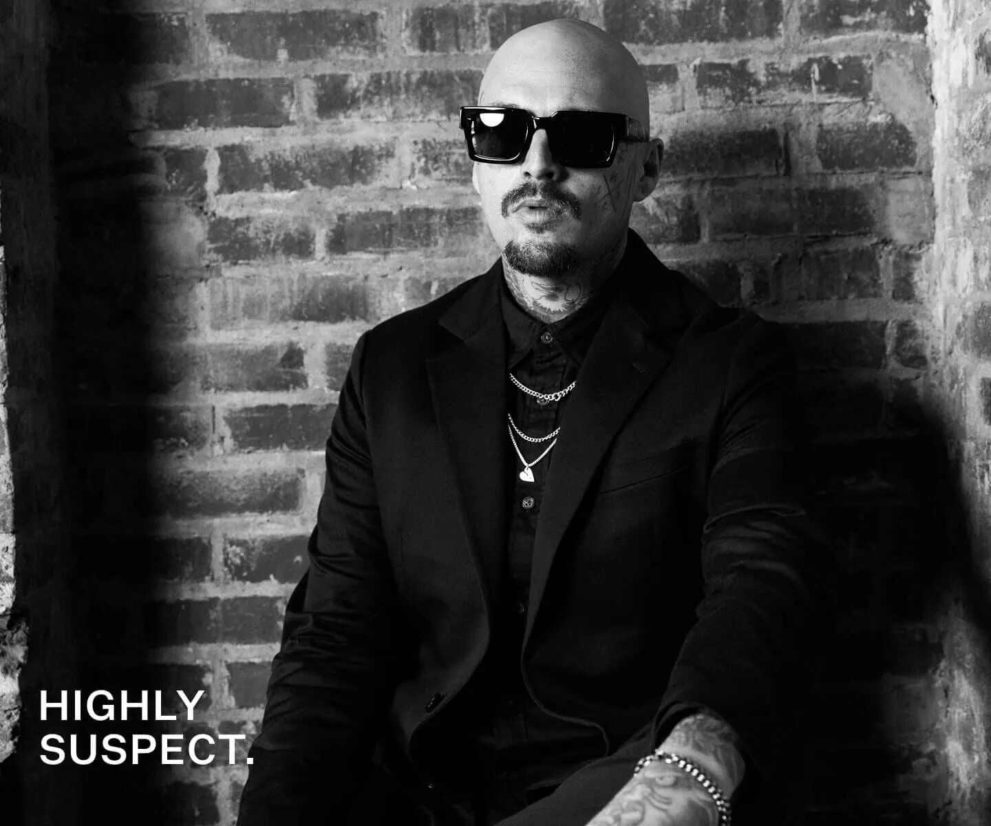 Closeup black and white shot of man in Highly Suspect singing.