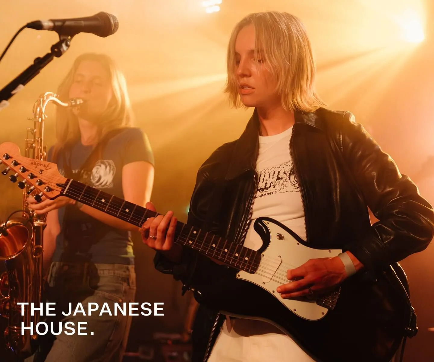 A profile shot of the frontsinger on stage.