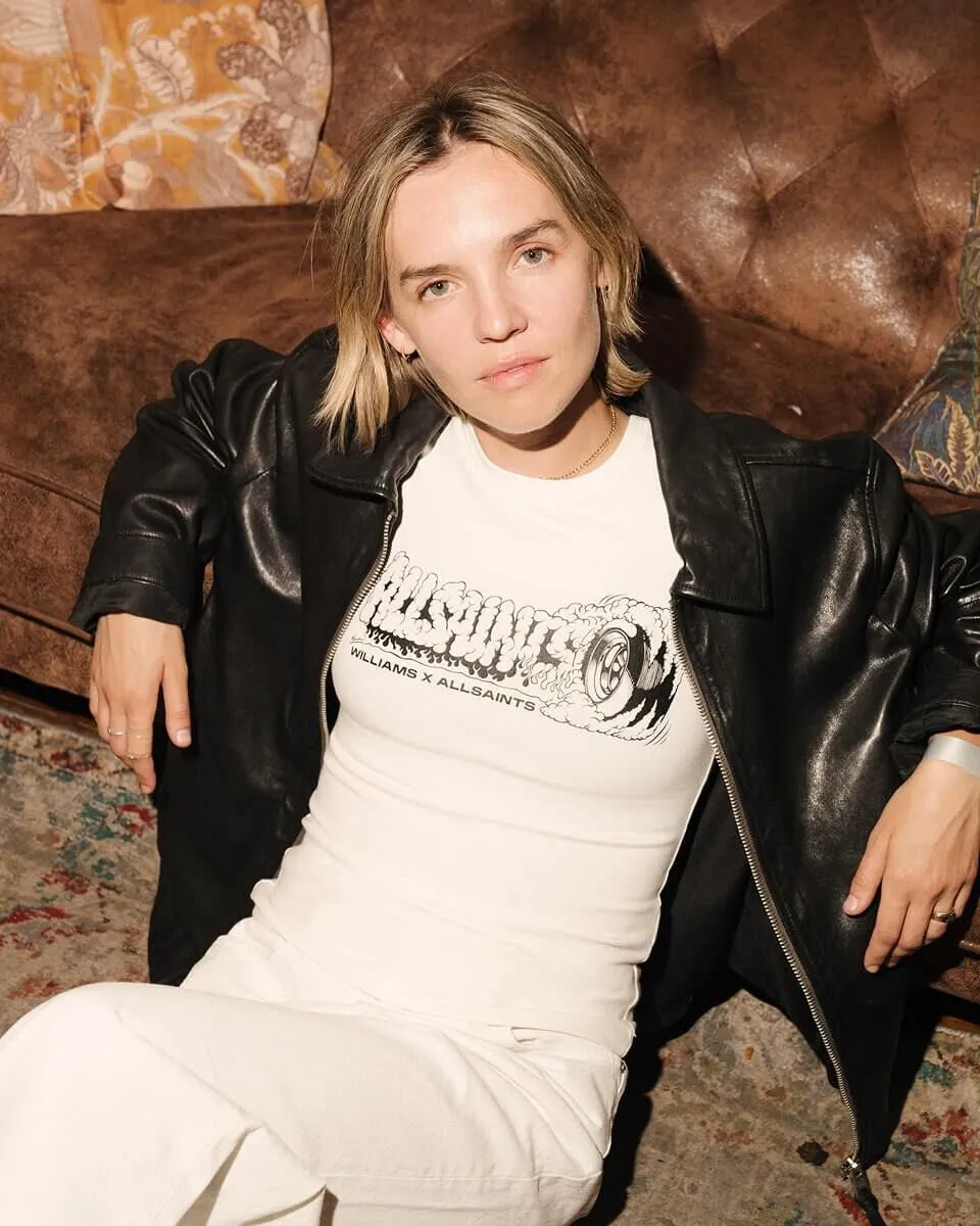 Fulllength shot of Darcey Salt posing on a chair.