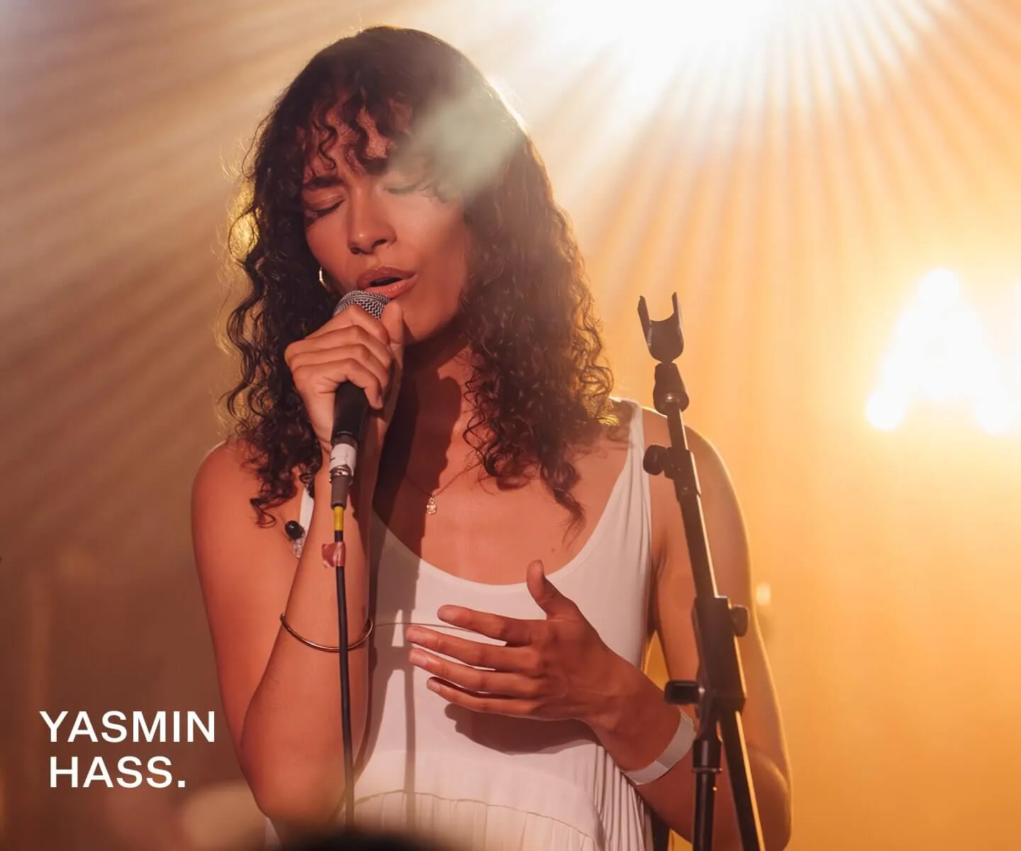 Closeup black and white shot of Storry singing.