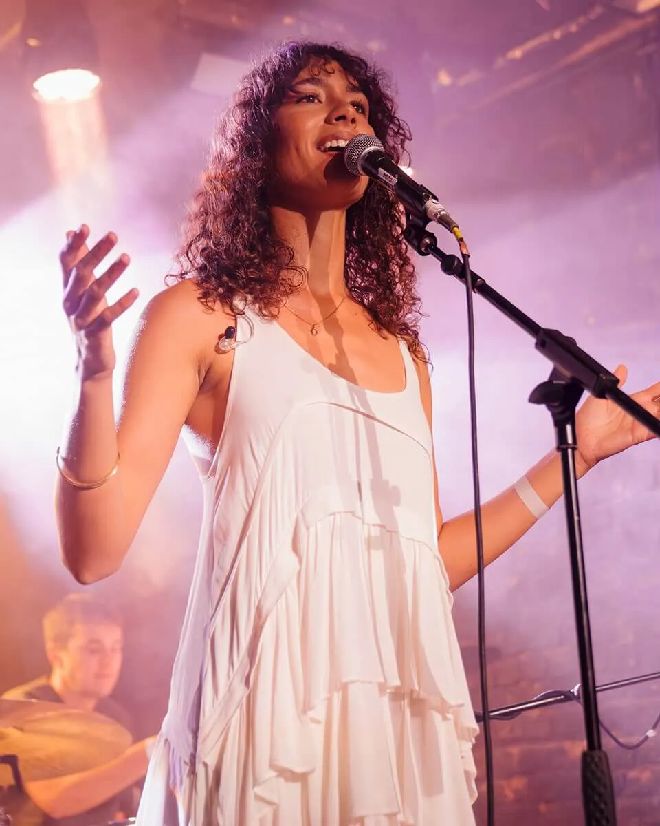 Full length shot of FLAT MOON posing infront of a wall.