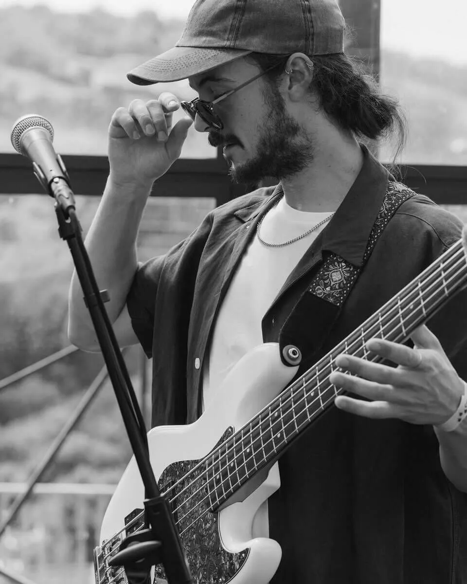 Closeup black and white shot of the guitarist.