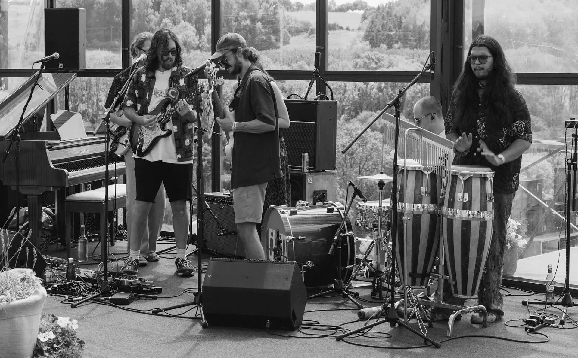 A black and white shot of the band performing.
