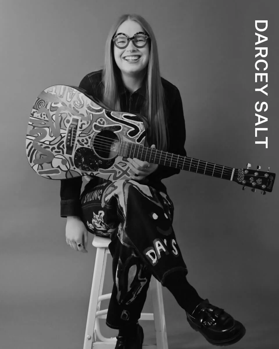 Fulllength shot of Darcey Salt posing on a chair.