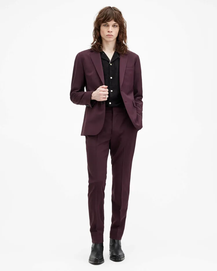 Man wearing a burgundy tailored suit.